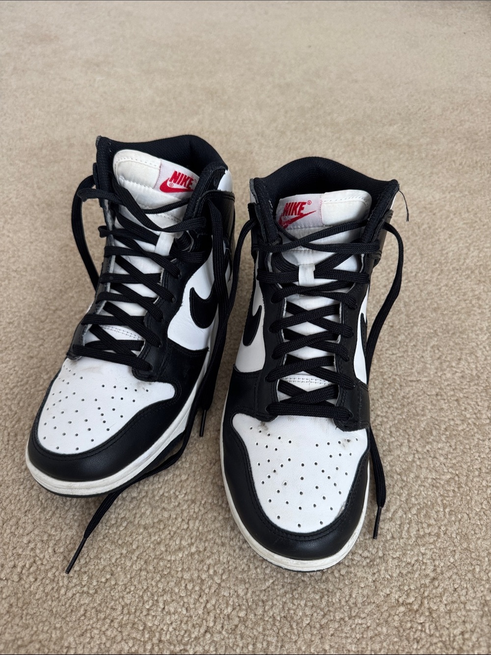 Nike Black and White High-Top Sneakers with Red Tongue Logo
